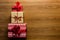 Christmas tree made of beautifully wrapped presents on wooden background