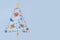 Christmas tree made of decorative ocean items: seashells, starfish, vessels, lighthouses, lifebuoys, steering wheels, anchors. New