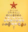 Christmas tree made of decorative sea shells and seastar on pastel yellow background. Christmas or New Year holidays at sea.