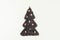 Christmas tree made from freshly roasted coffee beans with candies sweetmeats on white table. Winter concept. Creative.