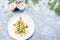 Christmas tree made of kiwi and fruit jelly on a plate with fir branches and decorations. Top view, copy space