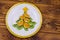 Christmas tree made of kiwi slices and mandarin lobules on wooden table. Top view.