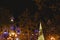 Christmas tree made with luminous LEDs at night next to the historical building of the city hall of Valencia, Spain.