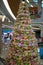 Christmas tree made from many colorful stuffed toys in shape of small cute mice. Lunar New Year decorations in shopping mall