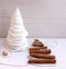 Christmas tree made of paper, cinnamon, pistachio New Year composition