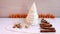 Christmas tree made of paper, cinnamon, pistachio New Year composition