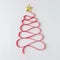 Christmas tree made of red ribbon. Minimal Christmas concept