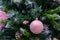 Christmas tree with matte pink ball with snowflakes. Festive Christmas background design. New year seasonal holiday, christmas