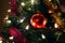 Christmas tree ornaments, red ball, tinsel