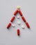 Christmas tree from Pharmacology assorted medicine pills, tablets and capsules. Different colors tablet on white