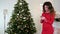 Christmas tree photo, girl photographed on a mobile phone Christmas tree with toys, beautiful Christmas tree with