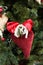 Christmas tree with red handcrafted heart decorations.