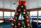 A Christmas Tree With Sailing-Themed Decorations, In A Marina Clubhouse. Generative AI
