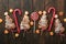 Christmas tree shape puff pastry cakes with chocolate filling, sugar powder and lollipops on old wooden background. Christmas, New