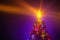 Christmas tree with shining star and frozen mist