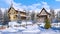 Christmas tree on snow covered alpine town square