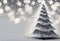 Christmas tree with snowflakes and bokeh on grey background