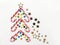 Christmas tree symbol composition. Caramel candy sticks and golden star. Flat lay with copy space.