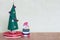 Christmas tree toy with a lady decorating with colorful balls, gifts and snowmen
