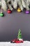 Christmas tree on toy Red Truck car on snow, balls christmas tree branches. Christmas holiday celebration concept
