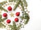 Christmas tree toys, golden stars and fir branch on a white background.