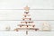 Christmas tree of wooden sticks and toys made of berries. Flat l