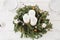 Christmas tree wreath with white candles lying on the table, Christmas decor