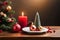 Christmas trees, Christmas decorations ... candle, various succulents a red balls, on a rustic wooden table.Ai generated