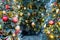 Christmas trees with lots of balls, toys and baubles, copy space