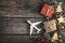 Christmas trip concept background. Plane with christmas decoration