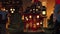 Christmas village with decorated ceramic houses lit by candles. Group of colored houses. Holiday time