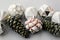 Christmas vintage ornaments on grey paper. Stylish vintage glass baubles and pine cones, scandinavian minimal style. Season`s