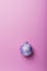 Christmas violet ball on the pink background