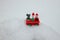 Christmas wagon with toys staying in snowbank in the snow winter day