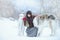 Christmas walk. Beautiful surprised woman in winter clothes with greyhound dogs graceful winter background with snow, emotions. po