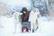 Christmas walk. Beautiful surprised woman in winter clothes with greyhound dogs graceful winter background with snow, emotions. po