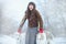 Christmas walk. Beautiful surprised woman in winter clothes with greyhound dogs graceful winter background with snow, emotions. po