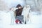 Christmas walk. Beautiful surprised woman in winter clothes with greyhound dogs graceful winter background with snow, emotions. po