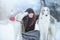 Christmas walk. Beautiful surprised woman in winter clothes with greyhound dogs graceful winter background with snow, emotions. po