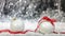 Christmas white balls, red ribbon and snow, abstract bokeh lights