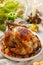 Christmas whole roast chicken with tangerines, apples and thyme