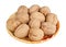 Christmas whole walnuts lie on a dish isolated