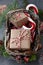 Christmas wicker basket with gifts or present boxes