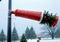 A Christmas Windsock In A Blustery Snowstorm, With A High Camera Angle. Generative AI