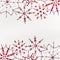 Christmas or winter concept. Frame of various handmade red snowflakes made from beads and bugle on white desk background