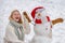 Christmas winter poeple. Greeting snowman. Winter scene with happy people on white snow background. Winter portrait of