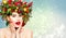 Christmas Woman Beauty in Xmas Wreath. New Year Fashion Model Happy Laughing, Open Mouth. Emotional Face, Red Lipstick over Snow