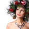 Christmas Woman. Fashion Girl with New Year Decorated Hairstyle.