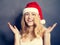 Christmas Woman in Santa Hat Having Fun. Smiling Xmas Model
