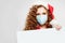 Christmas woman Santa in protective medical mask holding empty singboard card on white